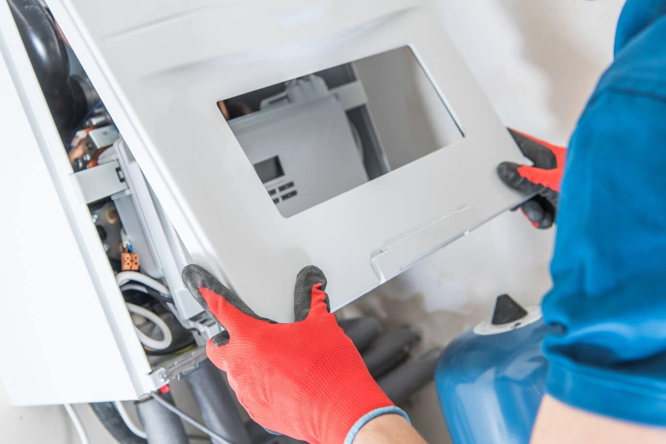 technician installing furnace