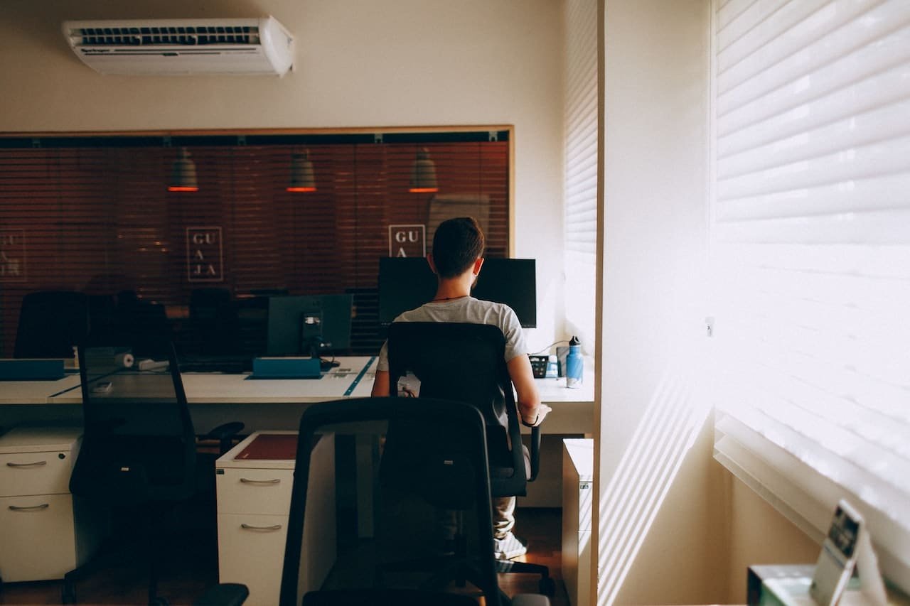 person working in room with air conditioning